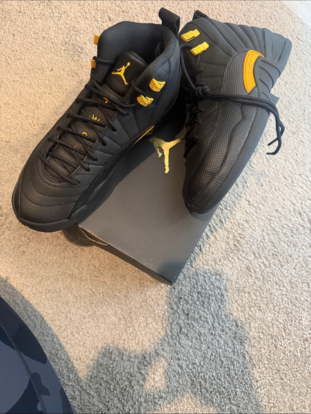 Jordan Retro 12 (Taxi) High-Top Sneakers in Black and Yellow